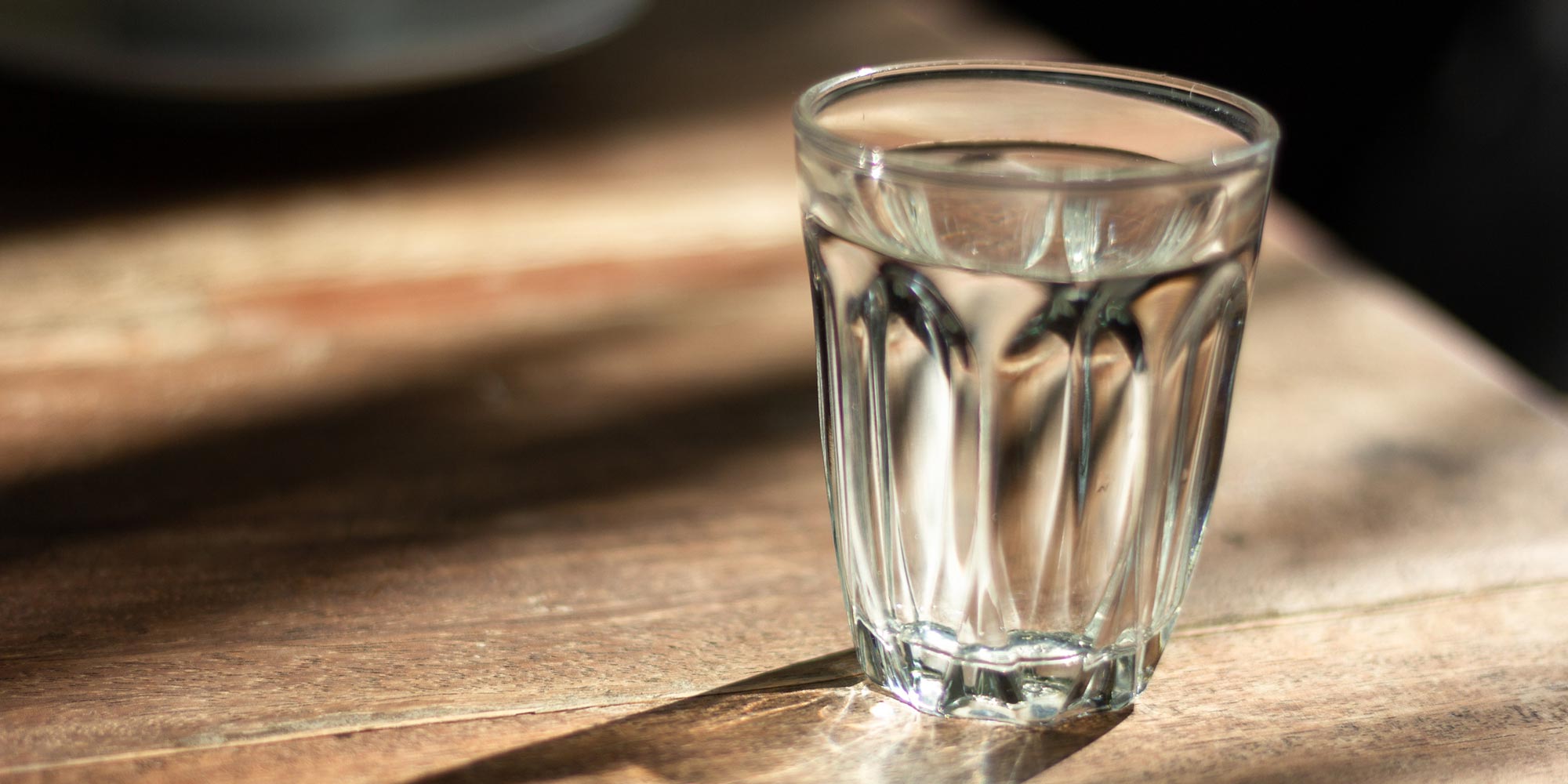 Cup of water on table